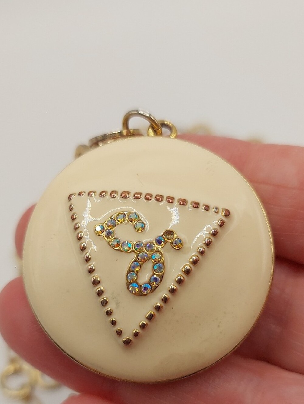 GUESS Blingy AB Gold-Tone Long Pendant Necklace with Cream Enamel Locket - Picture 11 of 14